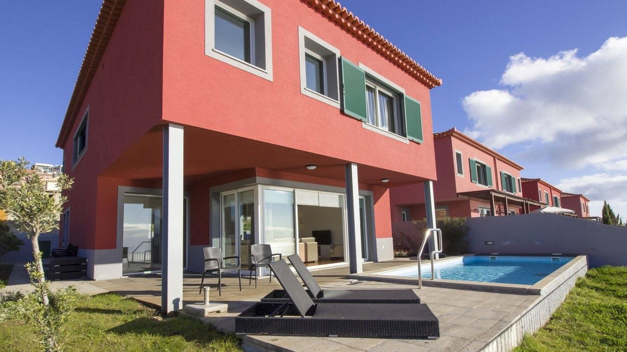 M608 rear view with garden and pool